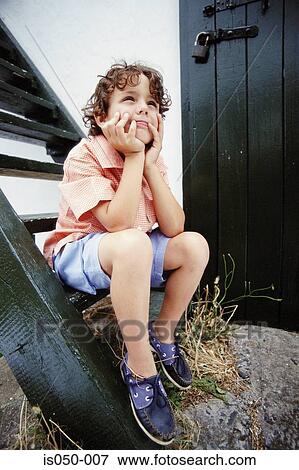 Thoughtful boy View Large Photo Image Stock Photo - Thoughtful boy. Fotosearch