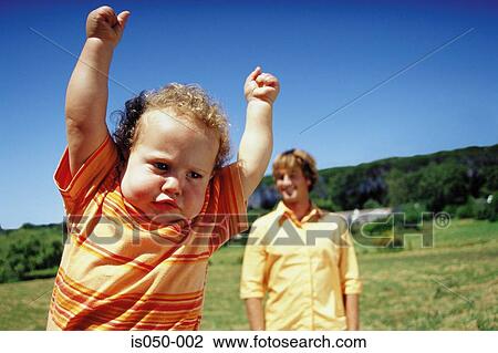 Toddler with arms in the air View Large Photo Image Stock Image - Toddler with arms in the air. Fotosearch