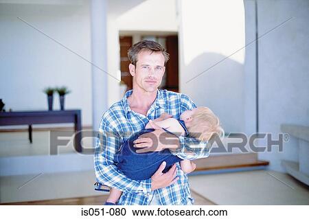 Baby sleeping in dad's arms View Large Photo Image Stock Image - Baby sleeping in dad's arms. Fotosearch