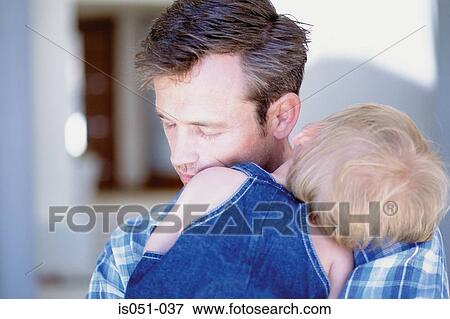 Baby sleeping in fathers arms View Large Photo Image Stock Photo - Baby sleeping in fathers arms. Fotosearch