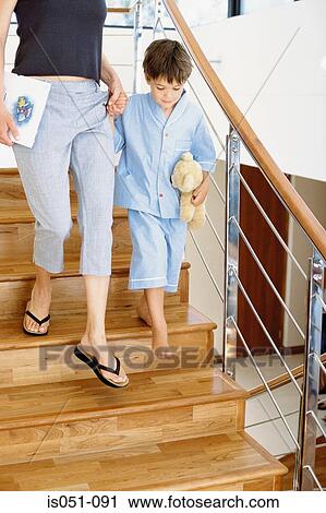 Boy and mum going down the stairs View Large Photo Image Stock Image - Boy and mum going down the stairs. Fotosearch