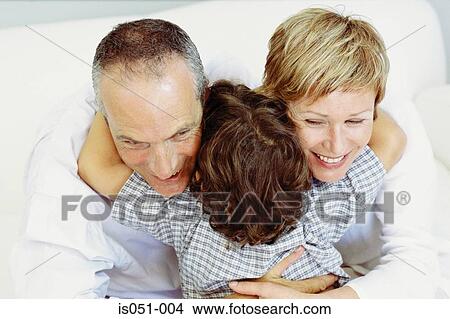 Boy hugging grandparents View Large Photo Image Picture - Boy hugging grandparents. Fotosearch