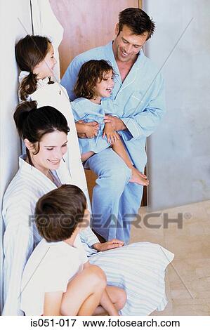 Stock Photo - Family having fun in the bathroom. Fotosearch