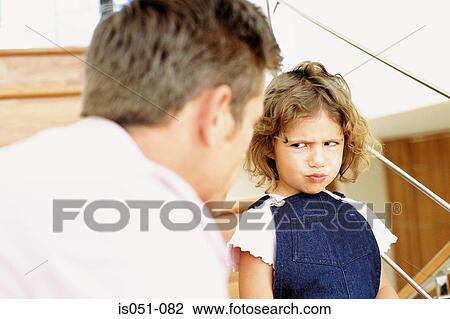 Father telling off naughty daughter View Large Photo Image Stock Image - Father telling off naughty daughter. Fotosearch