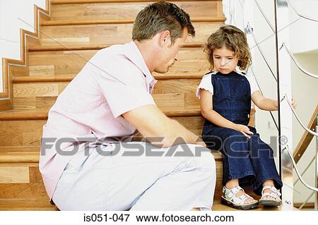 Father telling off naughty daughter View Large Photo Image Stock Photo - Father telling off naughty daughter. Fotosearch