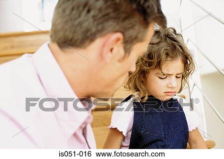 Father telling off naughty daughter View Large Photo Image Stock Photograph - Father telling off naughty daughter. Fotosearch