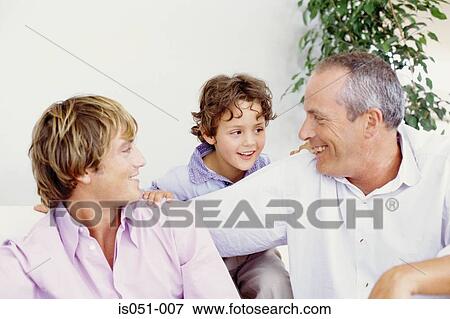 Grandfather with son and grandson View Large Photo Image Stock Photo - Grandfather with son and grandson. Fotosearch