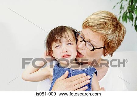 Grandmother and crying granddaughter View Large Photo Image Stock Photo - Grandmother and crying granddaughter. Fotosearch