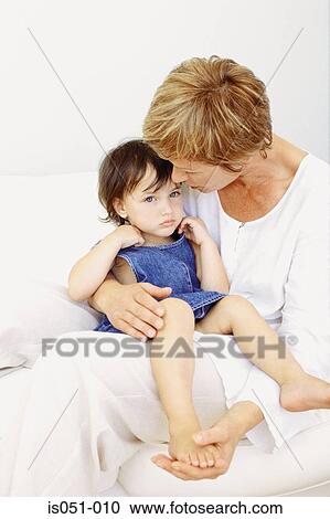 Grandmother comforting granddaughter View Large Photo Image Stock Image - Grandmother comforting granddaughter. Fotosearch