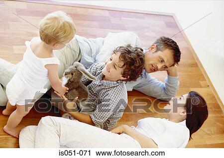 Kids playing while parents talk View Large Photo Image Stock Image - Kids playing while parents talk. Fotosearch