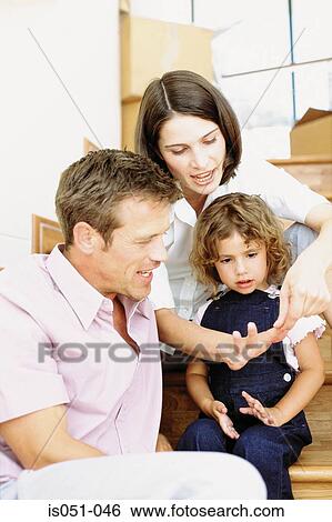 Parents teaching daughter to count View Large Photo Image Stock Photograph - Parents teaching daughter to count. Fotosearch