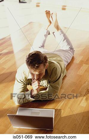Young businessman working from home View Large Photo Image Stock Photo - Young businessman working from home. Fotosearch