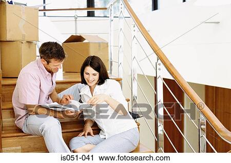 Young couple in their new house View Large Photo Image Stock Image - Young couple in their new house. Fotosearch