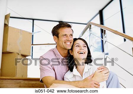 Young couple in their new house View Large Photo Image Stock Image - Young couple in their new house. Fotosearch