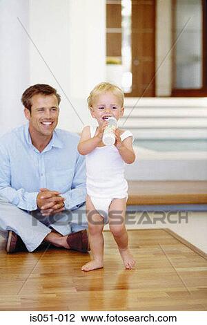 Stock Image - Young dad with toddler . Fotosearch