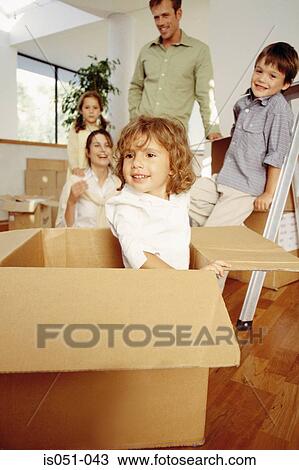 Young family unpacking in their new home View Large Photo Image Stock Image - Young family unpacking in their new home. Fotosearch