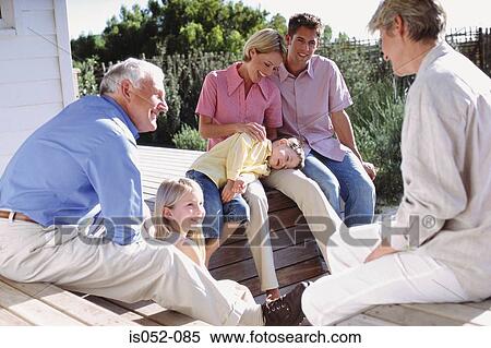 Family enjoying the sun View Large Photo Image Stock Photography - Family enjoying the sun . Fotosearch