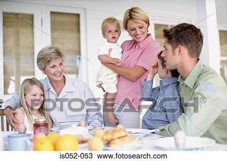 Stock Image - Family having breakfast. Fotosearch