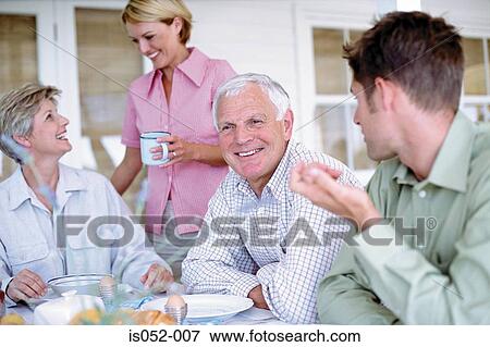 Stock Photo - Family having breakfast. Fotosearch