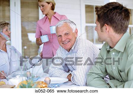 Family having breakfast View Large Photo Image Stock Photography - Family having breakfast. Fotosearch