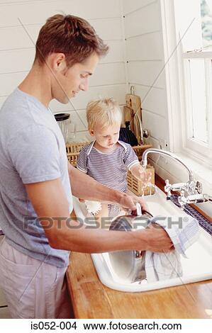 Father washing up and child playing with water View Large Photo Image Picture - Father washing up and child playing with water. Fotosearch