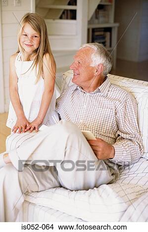 Picture - Grandad with granddaughter. Fotosearch