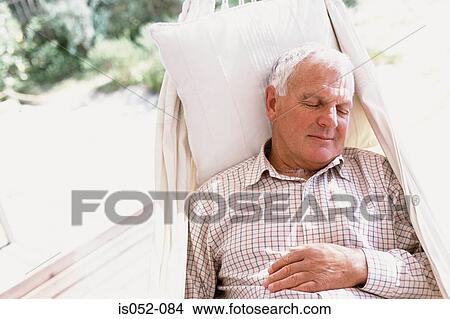 Man sleeping in a hammock View Large Photo Image Picture - Man sleeping in a hammock. Fotosearch