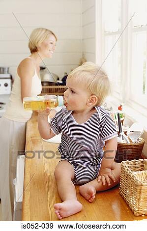 Stock Photo - Mother and child in the kitchen. Fotosearch