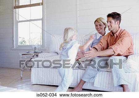 Parents playing with daughter View Large Photo Image Picture - Parents playing with daughter . Fotosearch