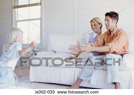Parents playing with daughter View Large Photo Image Stock Image - Parents playing with daughter . Fotosearch