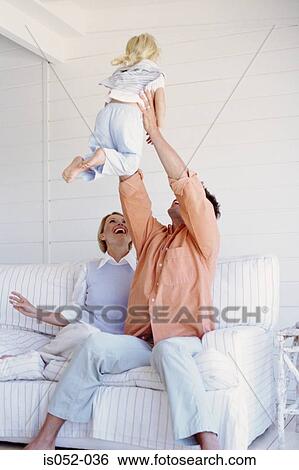 Parents playing with daughter View Large Photo Image Stock Photograph - Parents playing with daughter . Fotosearch