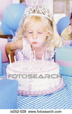 Portrait of a birthday girl blowing the candles View Large Photo Image Stock Photo - Portrait of a birthday girl blowing the candles. Fotosearch