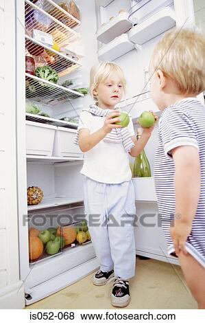 Sister and brother in the kitchen View Large Photo Image Stock Photo - Sister and brother in the kitchen . Fotosearch