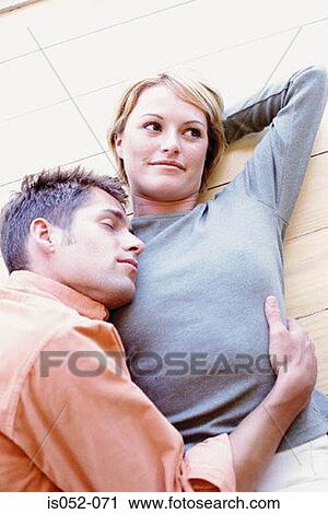 Young couple chilling out View Large Photo Image Stock Image - Young couple chilling out . Fotosearch