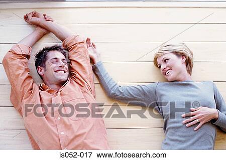 Young couple relaxing View Large Photo Image Stock Photo - Young couple relaxing. Fotosearch