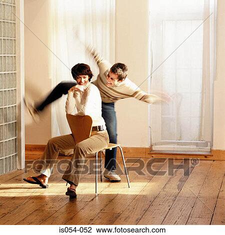 Couple having fun at home View Large Photo Image Stock Image - Couple having fun at home . Fotosearch