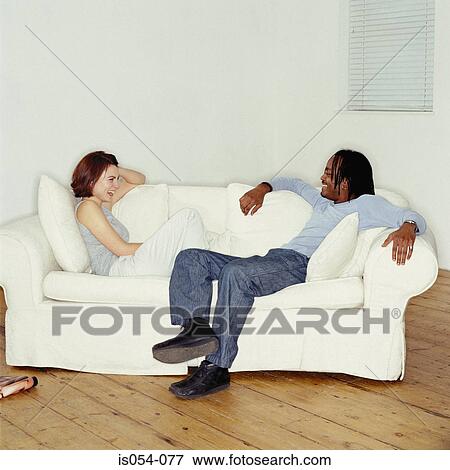 Stock Photo - Friends having a laugh. Fotosearch
