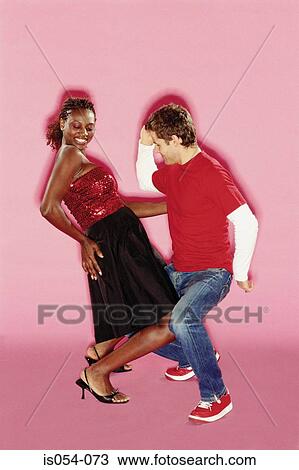 Stock Image - Funky couple dancing. Fotosearch