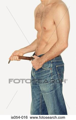 Man adjusting his belt  View Large Photo Image Stock Photograph - Man adjusting his belt . Fotosearch