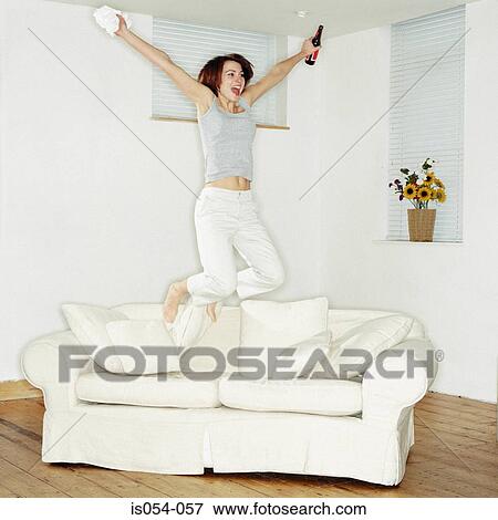 Stock Photo - Woman having fun at home. Fotosearch