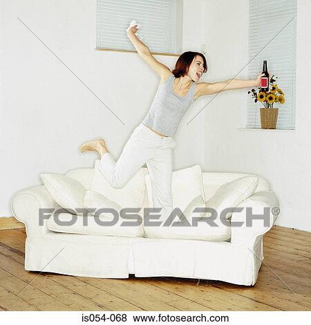 Stock Photo - Woman having fun at home. Fotosearch