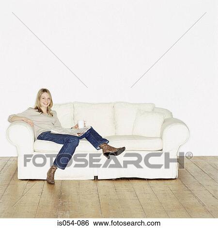 Woman relaxing at home View Large Photo Image Stock Photograph - Woman relaxing at home. Fotosearch