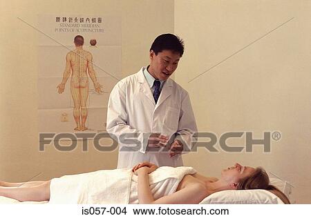 Acupuncture consultation View Large Photo Image Picture - Acupuncture consultation. Fotosearch