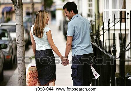 Couple holding hands View Large Photo Image Picture - Couple holding hands. Fotosearch
