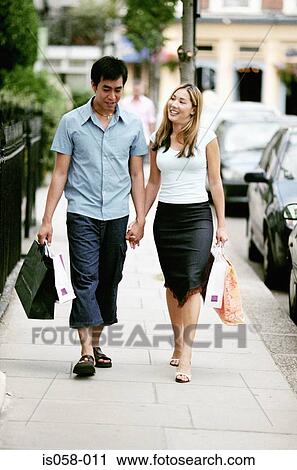 Couple holding hands View Large Photo Image Stock Image - Couple holding hands. Fotosearch