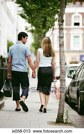 Couple holding hands View Large Photo Image Stock Image - Couple holding hands. Fotosearch