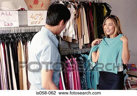 Couple in clothes shop View Large Photo Image Stock Image - Couple in clothes shop. Fotosearch