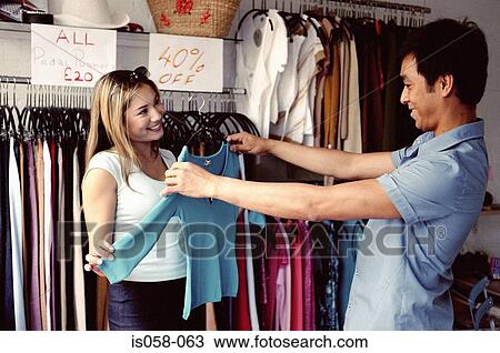 Couple in clothes shop View Large Photo Image Stock Image - Couple in clothes shop. Fotosearch