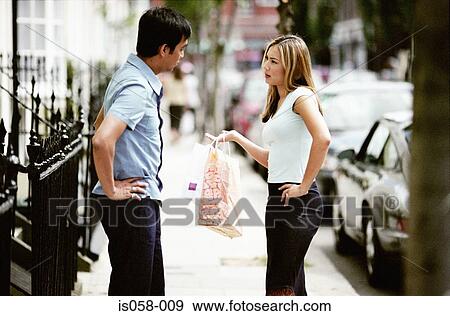 Couple in discussion View Large Photo Image Stock Photo - Couple in discussion. Fotosearch
