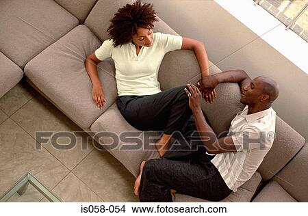 Couple on couch View Large Photo Image Picture - Couple on couch. Fotosearch